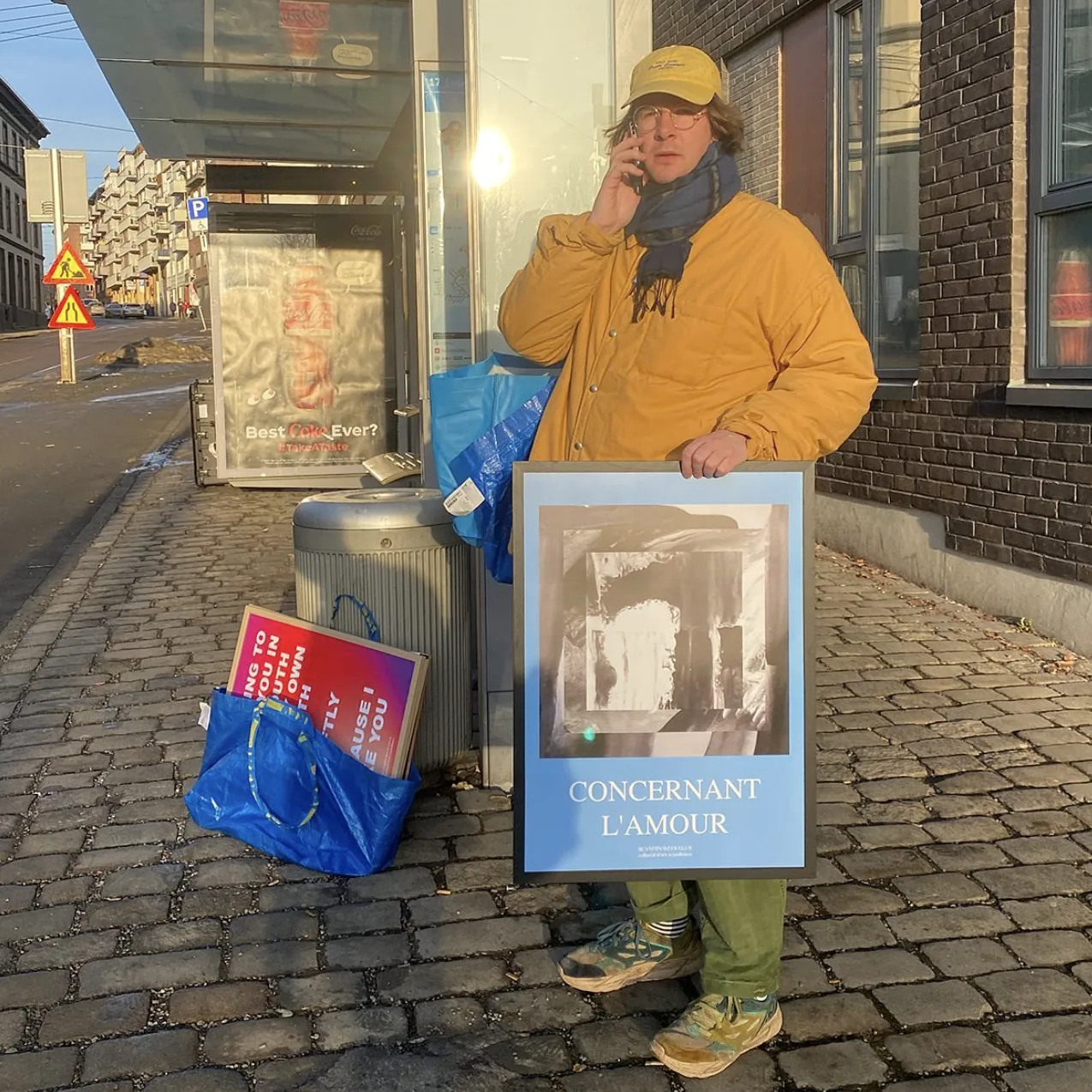 Mats holding a poster